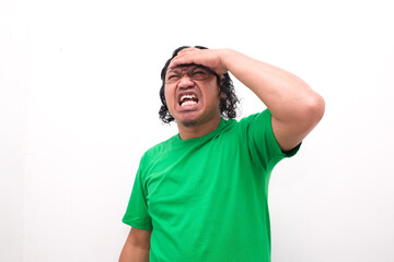 Fototapeta premium Asian man gesture who is feeling headache or migraine and vertigo isolated on white background