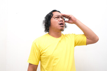 Asian man gesture who is feeling headache or migraine and vertigo isolated on white background