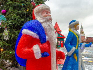 Figures of Santa Claus and Snow Maiden on Red Square in Moscow. Festive decorations in Moscow on...