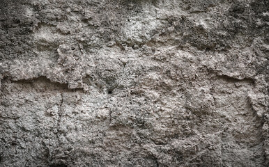 Empty light brown rough stone wall on cave for abstract  background and texture. beautiful patterns, space for work, banner, wallpaper close up.