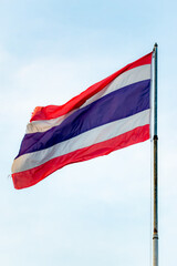 The Thai flag sits on the flagpole.