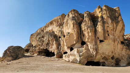 Metropolis Multi-Storey Settlement consists of small and large rooms carved into the southeastern slope of a tuff rock extending in the northeast-southwest direction.