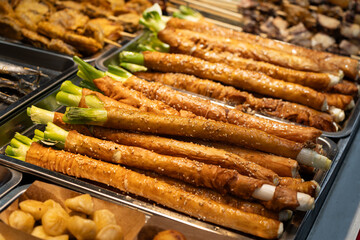 Fat sausage wrapped green onion gourmet snack