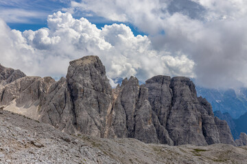 Dolomites mountains nasty weather in autumn with dark cloudy sky before the storm. Black clouds on the sky above the mountain rocky summits and peaks, stormy weather in the Dolomiti Alps, Italy