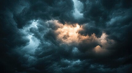 Obraz premium Dramatic dark summer storm clouds gather in the sky, creating a moody atmosphere. Captivating dark summer cloud formations add a sense of tension with ample copy space.