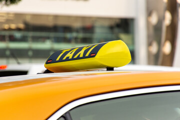 Close-up of Dubai yellow taxi sign, United Arab Emirates.
