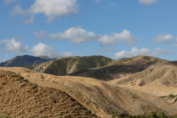 Rolling hills in the scenic landscape of remote parts of Kyrgyzstan