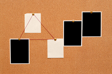 Blank paper notes and an empty photo are pinned to a cork board. The concept of detective...