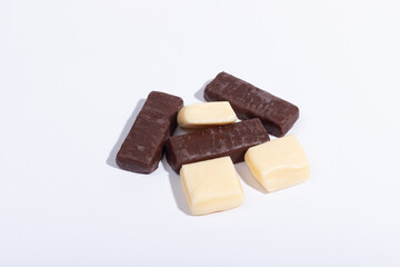 Chocolate and creme candies on a white background