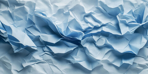 Obraz premium Icy blue crumpled paper texture with frosty shades. Subtle folds and creases evoke a cool and textured feel.