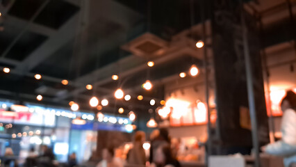 Cozy blurred coffee shop background in warm brown tones, inviting atmosphere.