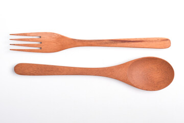 Top view of Wooden spoon and fork isolated on white background. A set of kitchen utensils