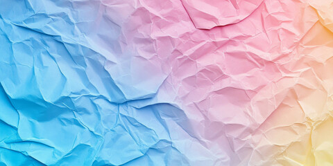 Obraz premium Pastel rainbow crumpled paper with soft transitions between pink, blue, and yellow hues. Creases add texture while maintaining gentle tones.