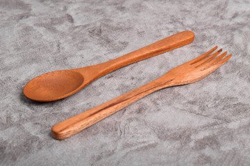 Wooden spoon and fork on table. A set of kitchen utensils
