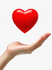 Obraz premium Hand Holding a Floating Red Heart on a White Background