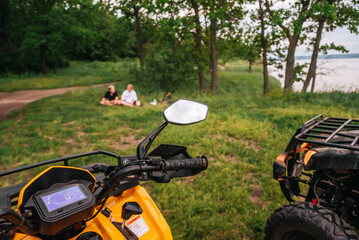 people resting after a quad bike ride in the forest © Julia Suhareva