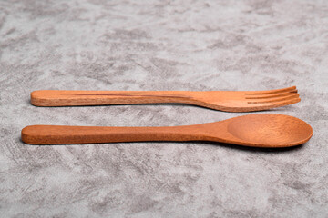 Wooden spoon and fork on table. A set of kitchen utensils