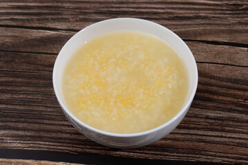 White rice, corn residue and yellow millet porridge in a small bowl
