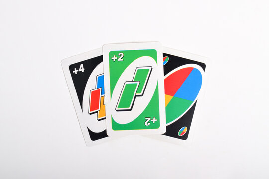 Pasuruan, Indonesia - November 26, 2024: Stack of UNO game cards isolated on white background