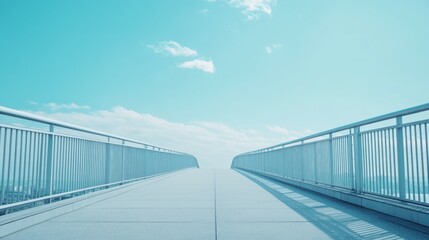 Obraz premium Empty Elevated Bridge Pathway Under a Clear Blue Sky: Modern Architecture in Perspective
