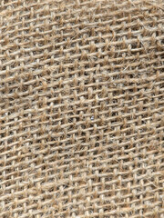 burlap - rough embossed texture of natural fabric close-up background