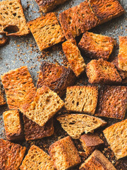 sliced ​​bread crackers on a dark background close-up, top view
