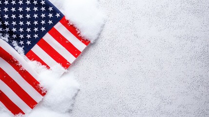 Obraz premium A partially obscured American flag on a snowy background, symbolizing patriotism and winter themes.