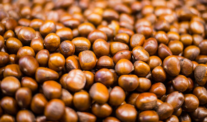 Close-up of a large group of red chestnuts.