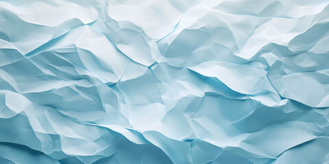 Obraz premium Icy blue crumpled paper texture with frosty shades. Subtle folds and creases evoke a cool and textured feel.