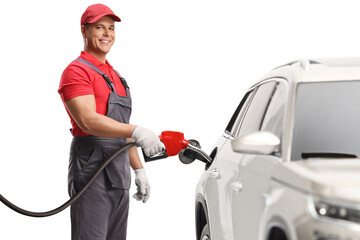 Gas station worker filling a suv with petrol and smiling