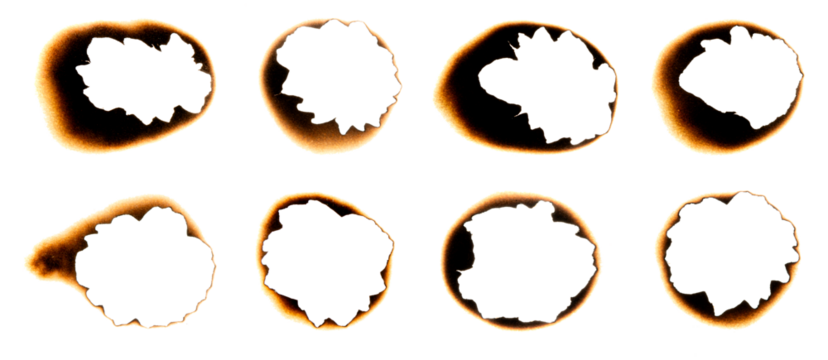 Burnt holes in a piece of paper