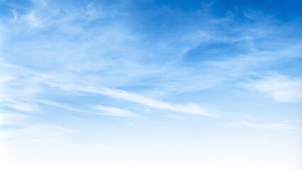 A serene blue sky filled with fluffy white clouds, creating a calm and beautiful natural landscape backdrop.