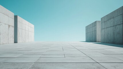 Obraz premium A Minimalist Concrete Architectural Perspective. Modern Building Design with Geometric Elements. Empty Concrete Space under a Clear Sky