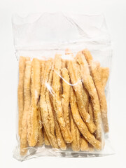 A clear plastic bag filled with crispy and crunchy traditional Malaysian snacks, coated with sugar for a sweet and satisfying treat. Perfect for snacking anytime and sharing with friends or family.
