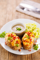 baked potatoes stuffed with cream, cheddar cheese and bacon