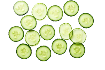 An assortment of cucumber slices with varying thicknesses, revealing the rich green hues and seed patterns, isolated on a clean white background for a fresh look.