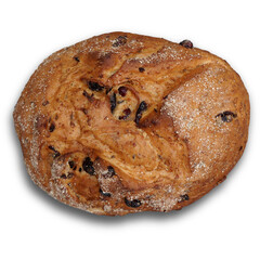 A round loaf of bread with a textured surface and dark fruit pieces, dusted with flour.