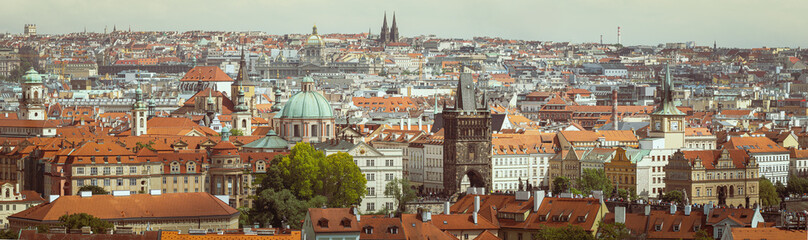 Skyline of Prague with Karluv most view, panorama of old town with ancient architecture, gothic spires, temples and medieval towers.