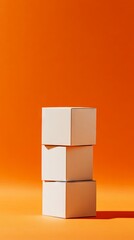 Obraz premium Stacked White Boxes on Orange Background