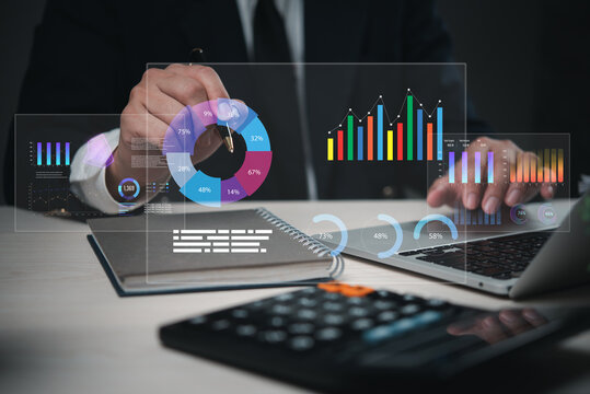 Businessman data analyzing digital graphs, charts, and marketing big data with futuristic holograms, data-driven decisions. Great for financial reports,