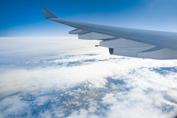 View of snow covered Greenland from an airplane window