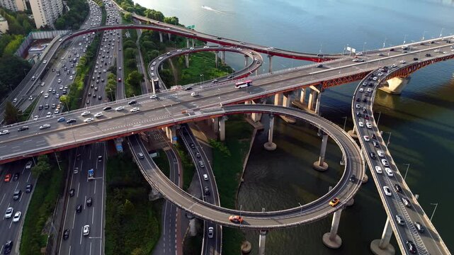 Sunset aerial video of road junction at the bridge across the Han river in Seoul, South Korea