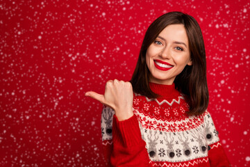 Portrait of cute adorable person toothy smile indicate thumb finger empty space ad isolated on red color background