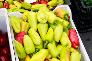 raw peppers vegetables plastic box counter retail place for food meal