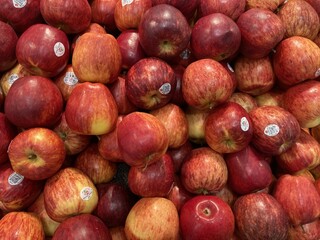 A Pile of Red and Yellow Apples in a Grocery Store Display, Fresh and Juicy Red Delicious Apples Ready to be Purchased
