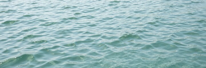 Fototapeta premium Rippling water surface with small waves and reflections of light, water, soothing