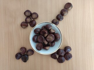 Shiny brown chestnuts on the table