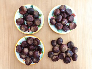 Shiny brown chestnuts on the table
