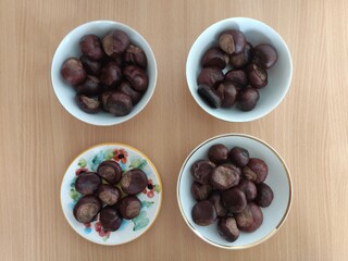 Shiny brown chestnuts on the table