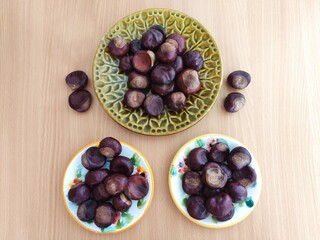 Shiny brown chestnuts on the table